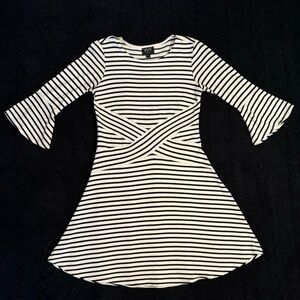 ECI New York black and white striped knit dress with bell sleeves.